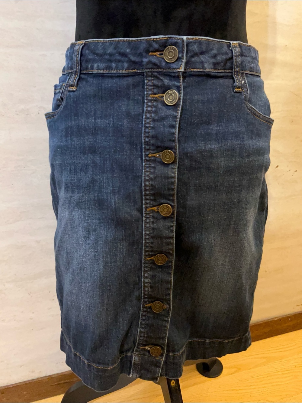 KUT from the Kloth button-front denim mini skirt.